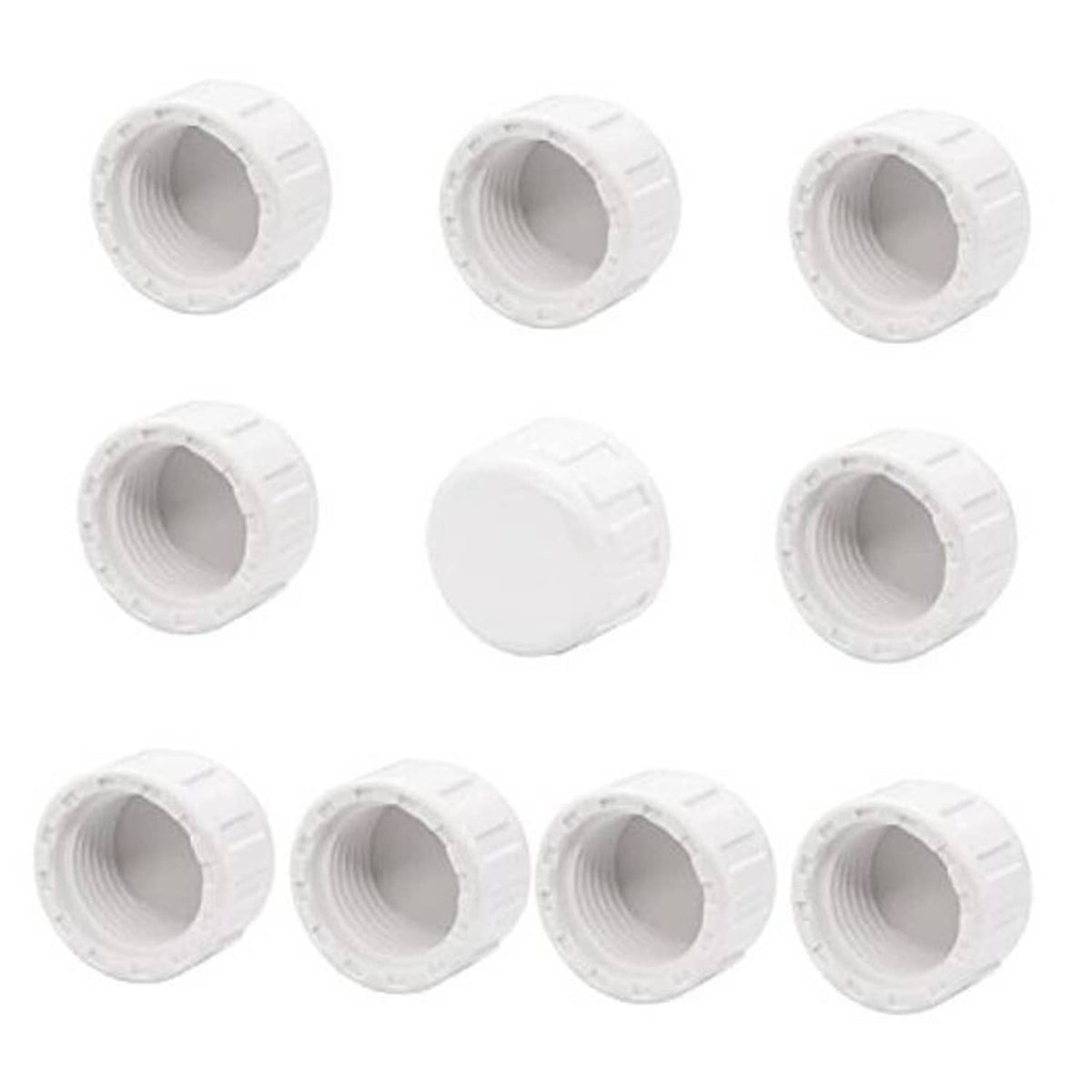 Set of white PVC female thread pipe plug adapters, multiple ridged caps