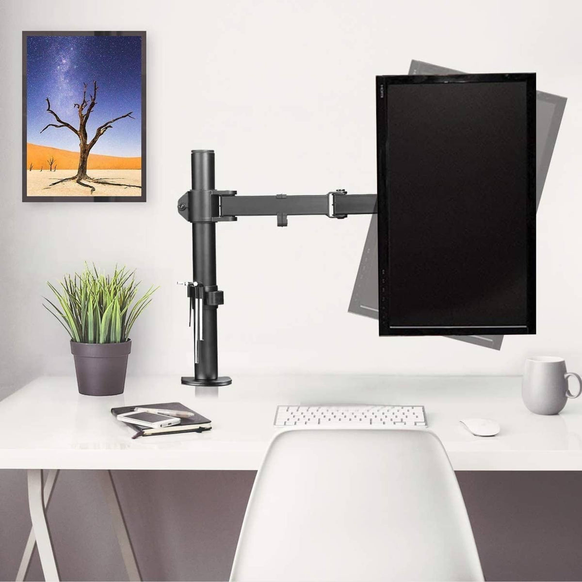 Single monitor arm desk mount with VESA plate holding a flat-screen monitor