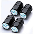 Set of 4 black aluminum tire valve stem caps with dragonfly graphic insets