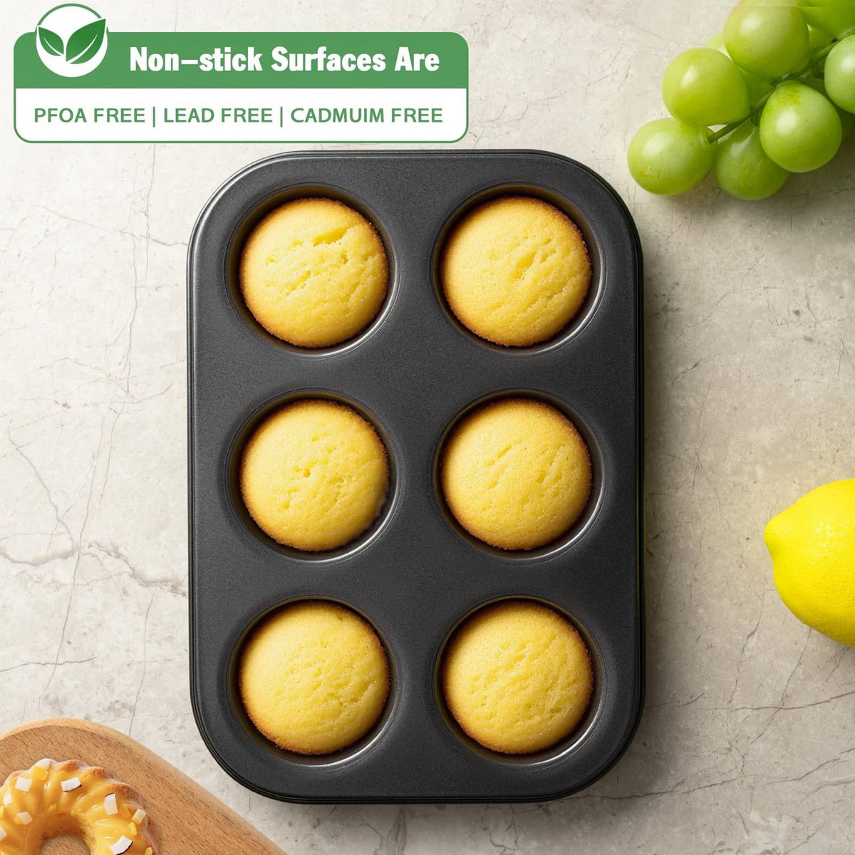 Mini tube cake pan with 6 cavities, holding six golden baked cakes