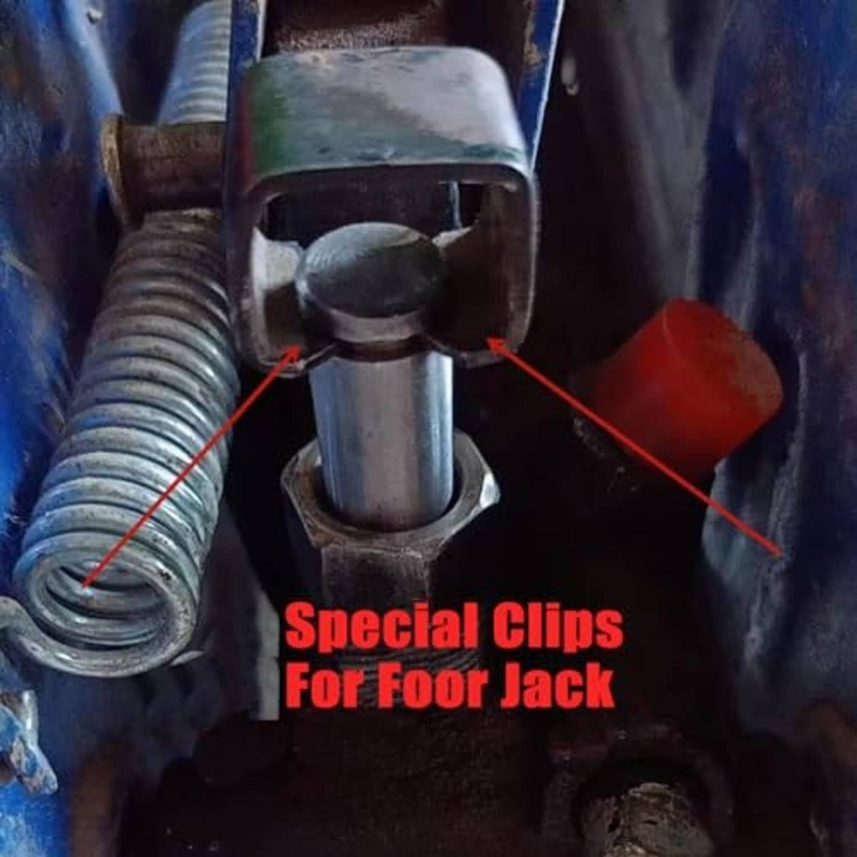Floor jack mechanism with black clamp clips installed on the top pin