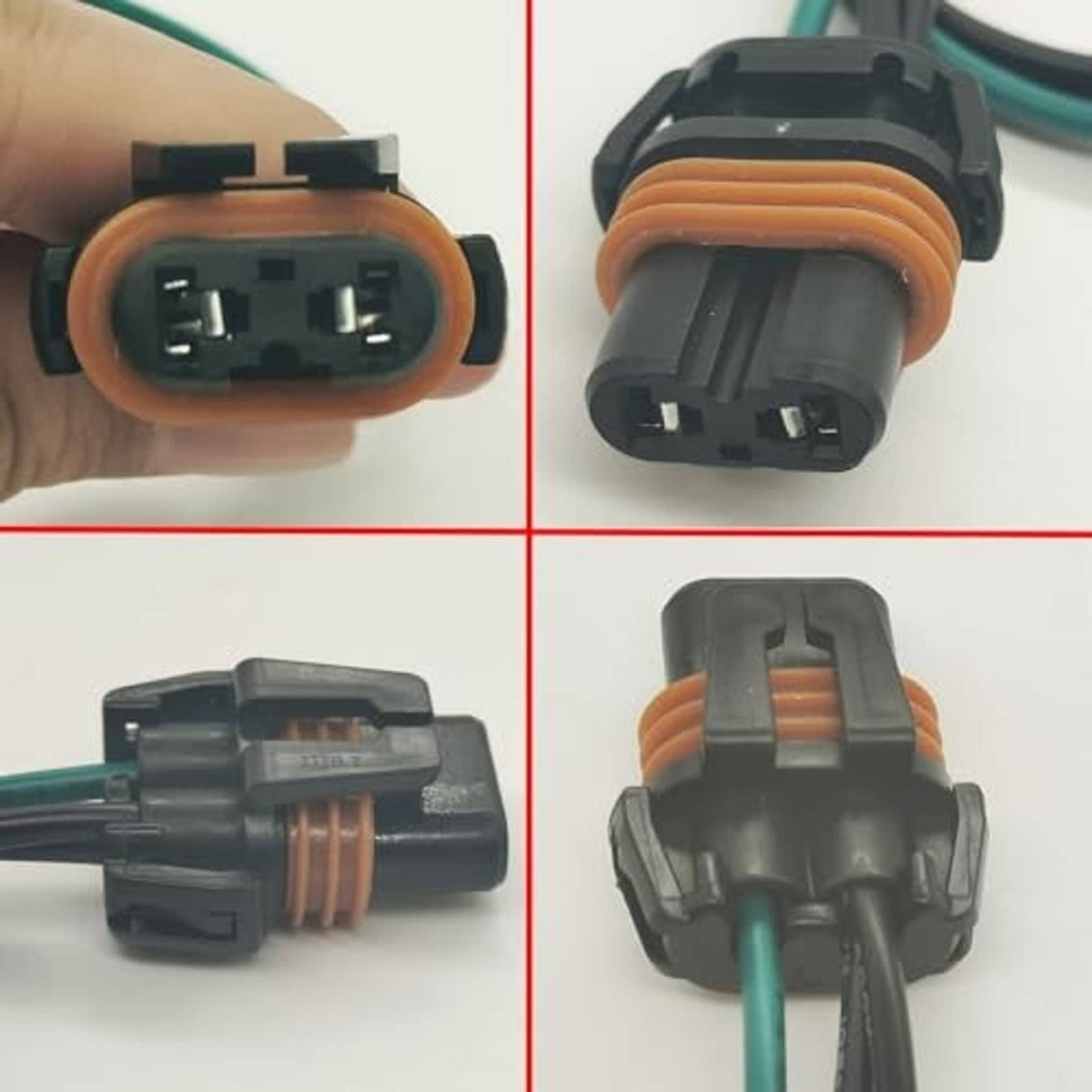 Matching headlight wiring connectors with orange seals and green/black wires, close-up