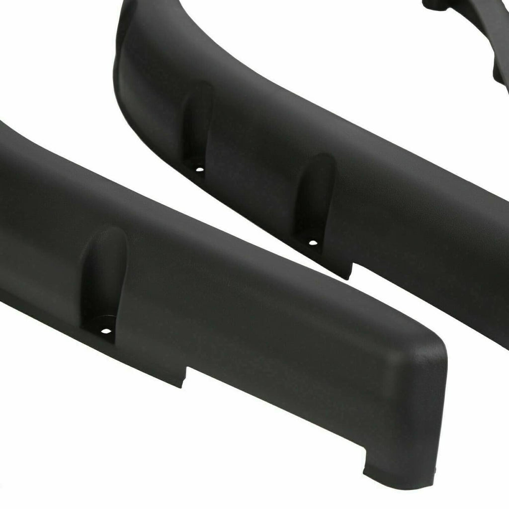 Black plastic fender flare with raised mounting tabs and holes