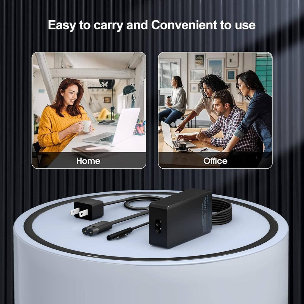 Black laptop charger brick with coiled cable and two adapter tips