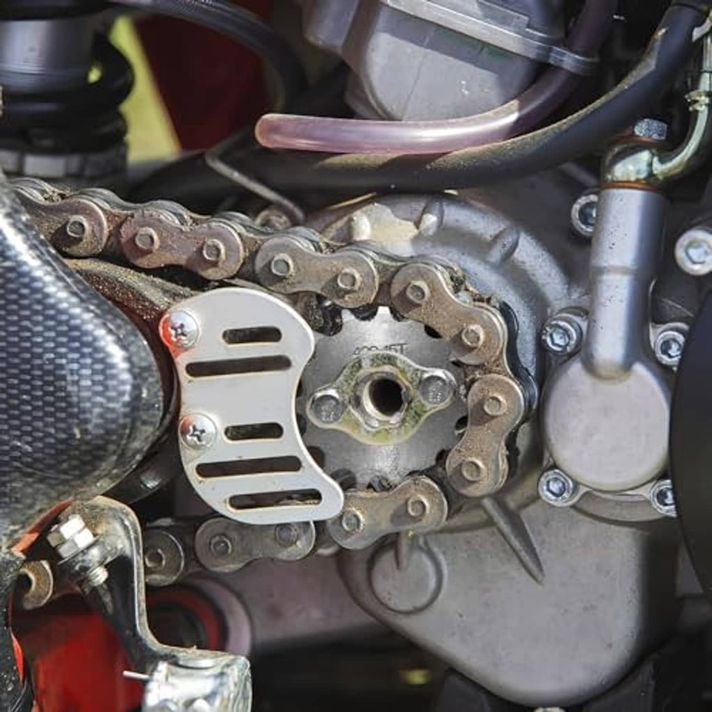 Front engine sprocket with drive chain and mounting area on motorcycle engine