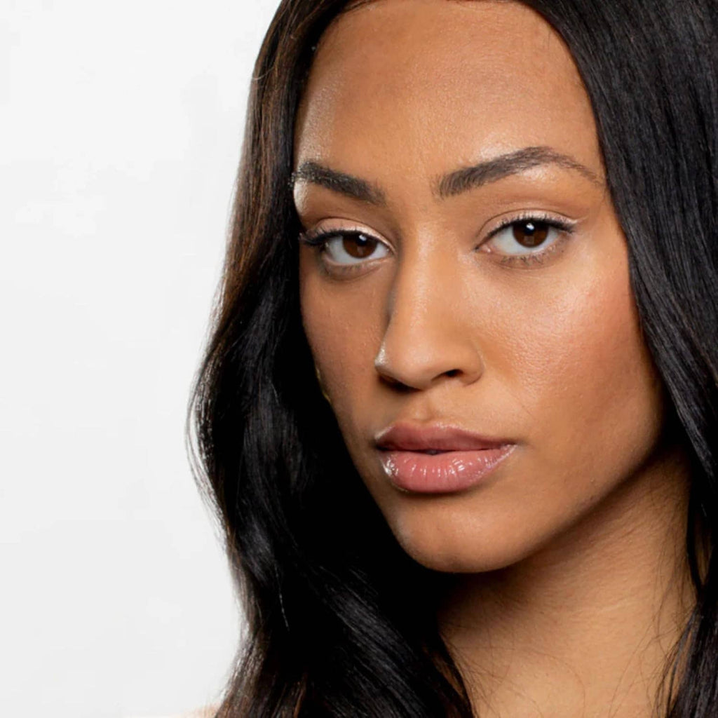 Woman wearing metallic eyeshadow with subtle bronze-gold shimmer on eyelids