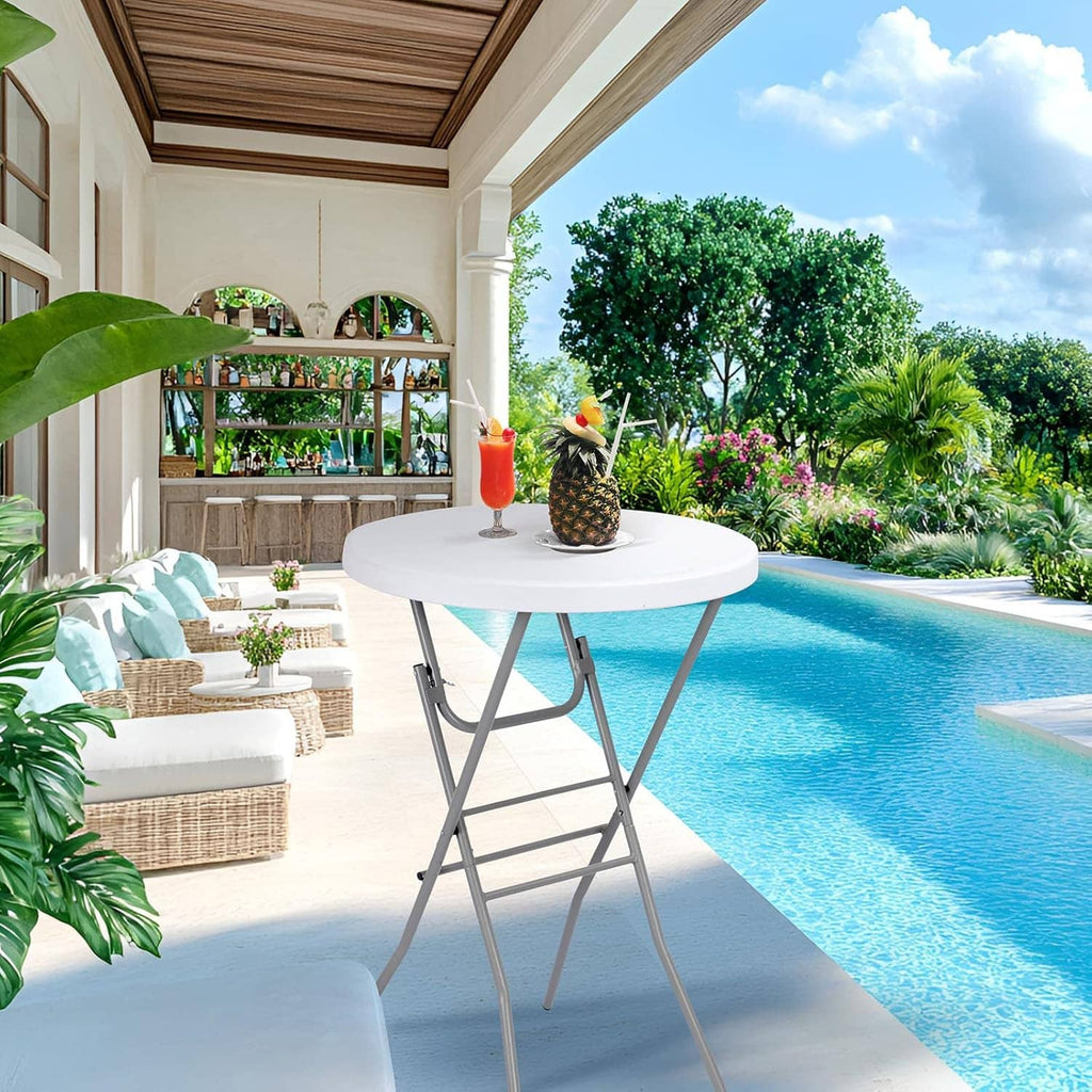 White round folding cocktail table beside a swimming pool