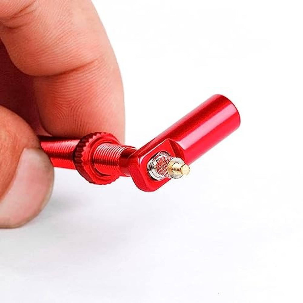 Red Presta valve stem cap and insert close-up