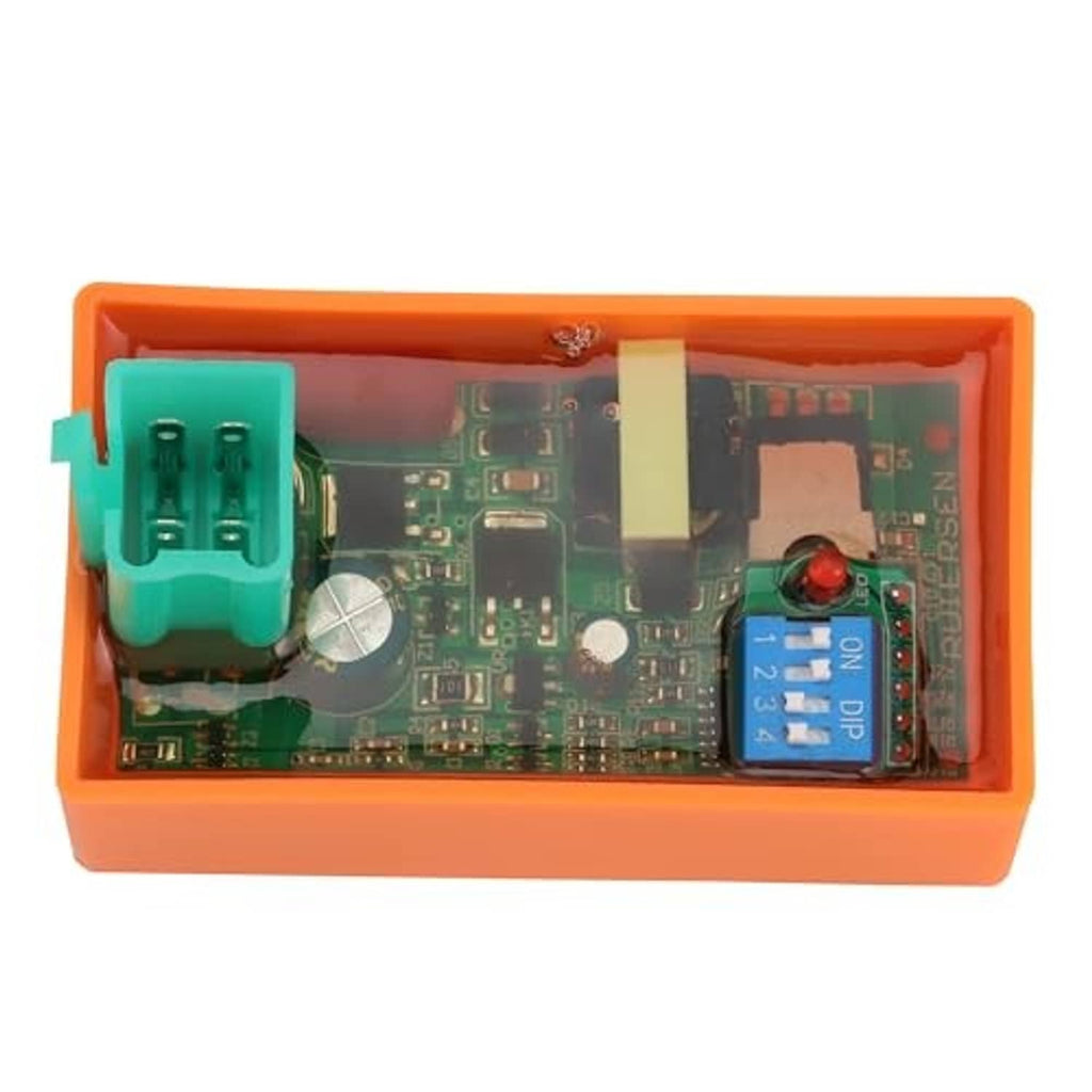 DC CDI ignition module PCB with green 4-pin plug and blue DIP switch in orange case