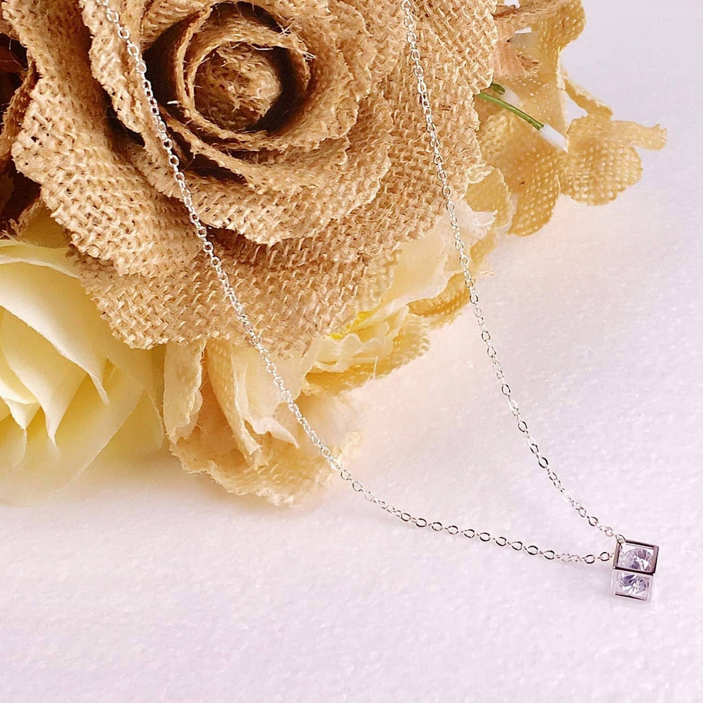 Silver-plated necklace chain with small square-stone pendant at the clasp end.