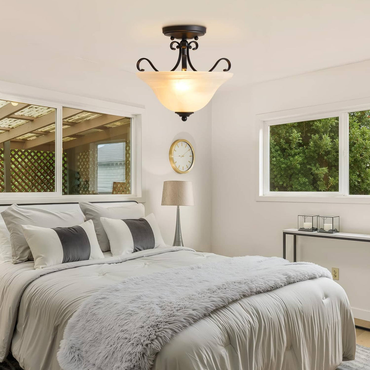 Black semi-flush ceiling light with frosted glass shade and soft warm glow