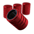 Ruby red anodized aluminum tire valve stem caps with textured grip and black interior
