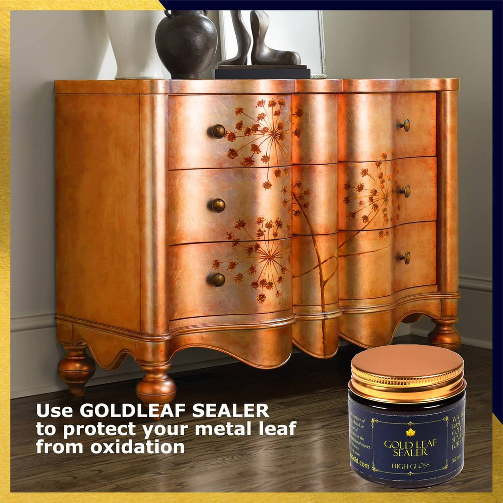 Gold leaf sealer jar with gold-leaf finished cabinet drawer surface in view
