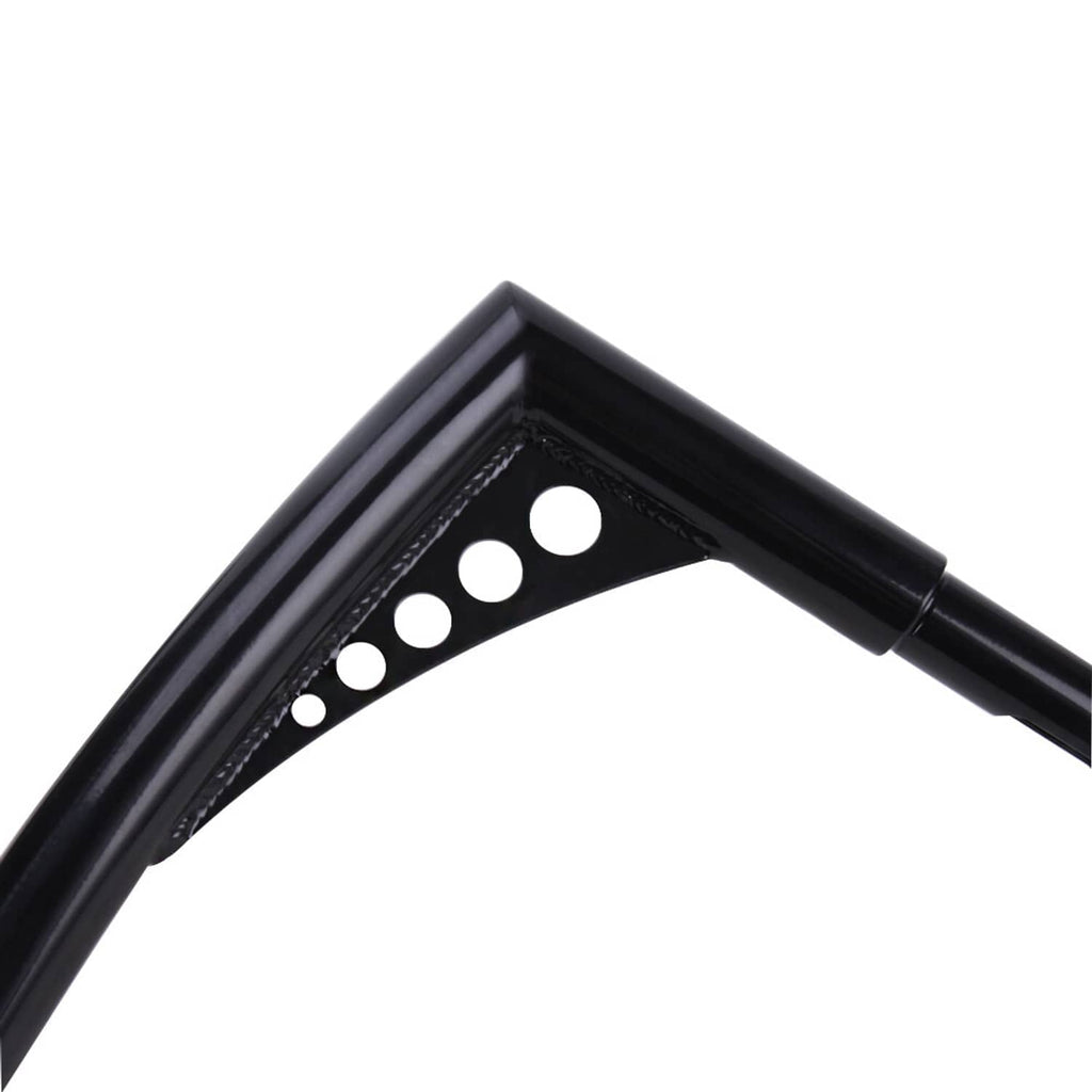 Close-up of black ape hanger handlebar with circular drilled holes on the bend
