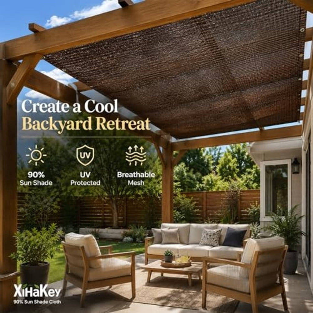 Brown sun shade cloth canopy stretched under pergola beams, grommet corners visible