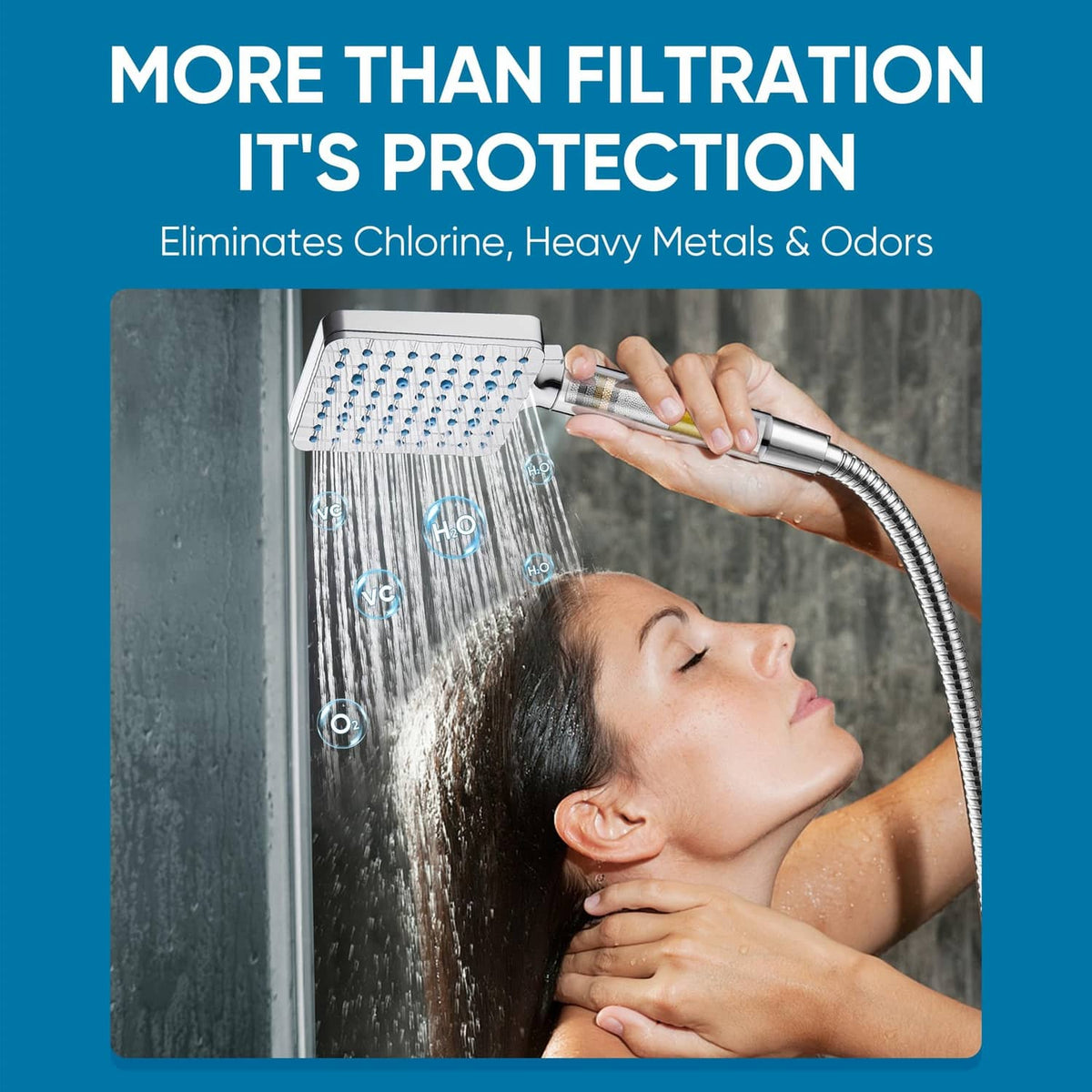Chrome handheld shower head spraying over a user’s shoulder in a shower