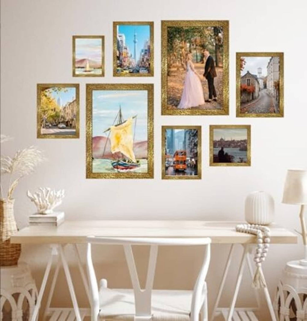 Two ornate gold photo frames with printed photos, hung as a wall display