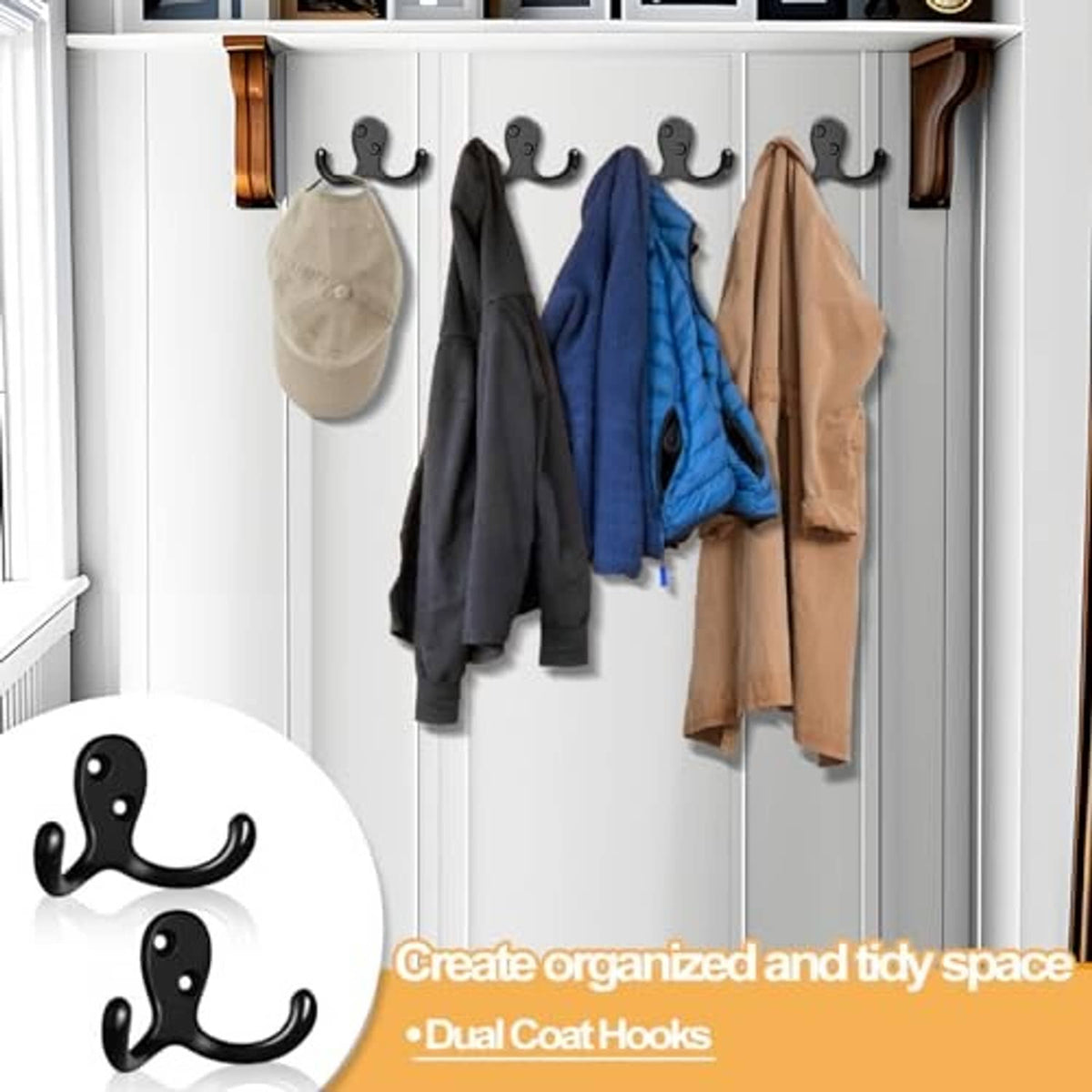 Black double-prong coat hooks on a closet door holding jackets, scarves, and tote bags