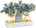 Mkono mason jar light centerpiece with blue faux roses in grey-blue jars on white tray