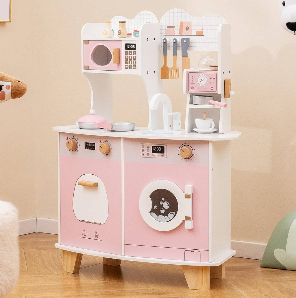 Wooden kids play kitchen in pink and white, with oven door, knobs, and coffee area