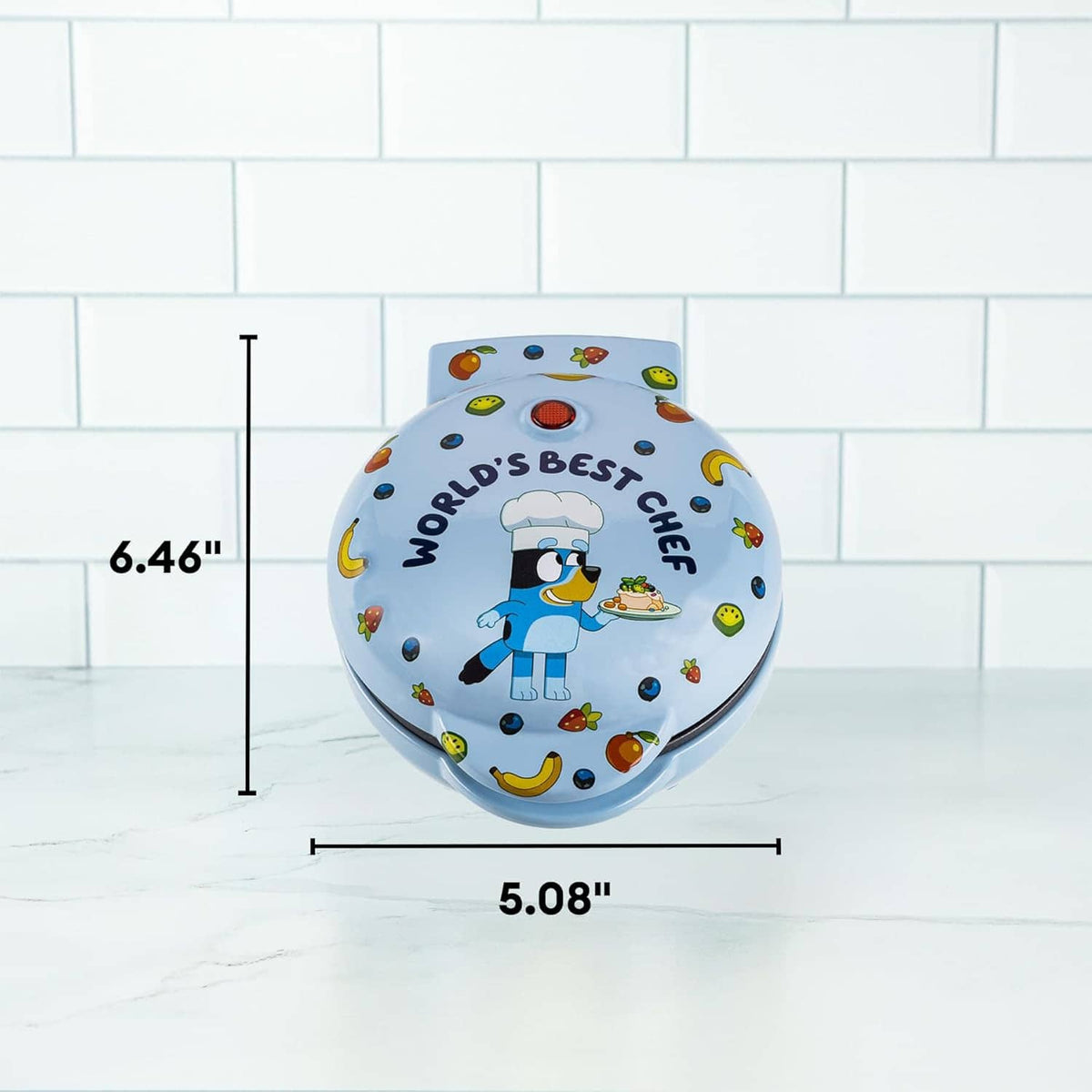 Light blue mini waffle maker with chef graphic; size labels 6.46 in and 5.08 in