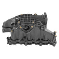 Black intake manifold assembly with circular throttle opening and mounting tabs
