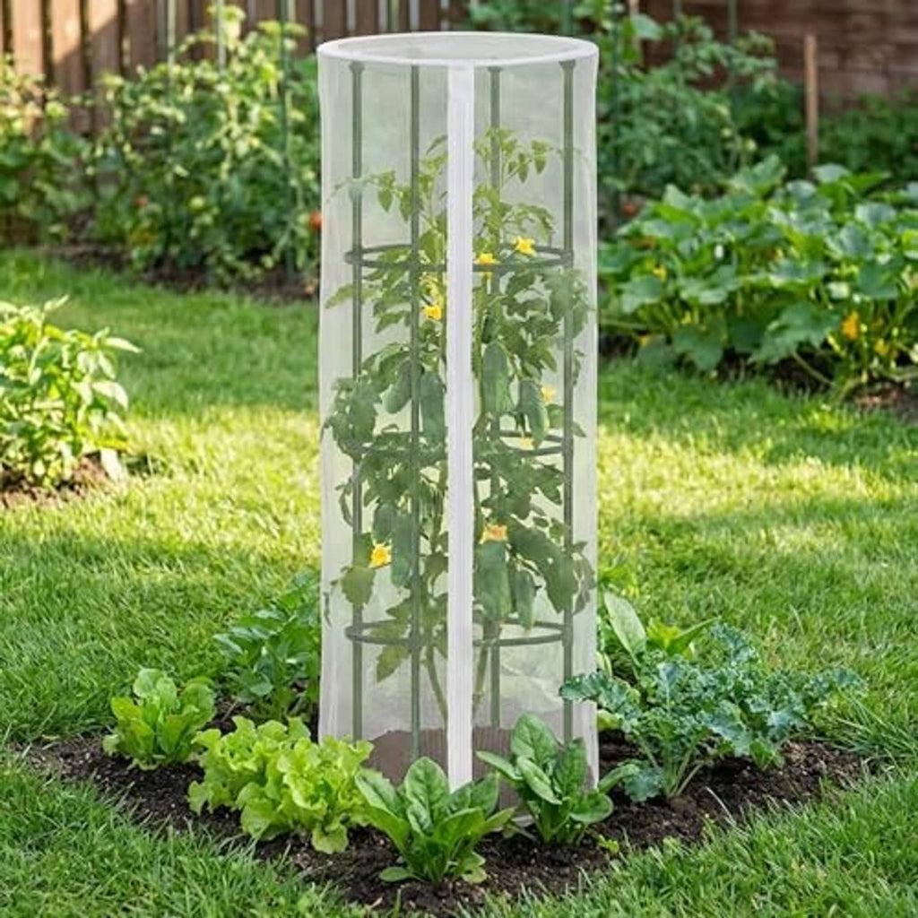White mesh bird netting cover standing over leafy plants in a garden bed