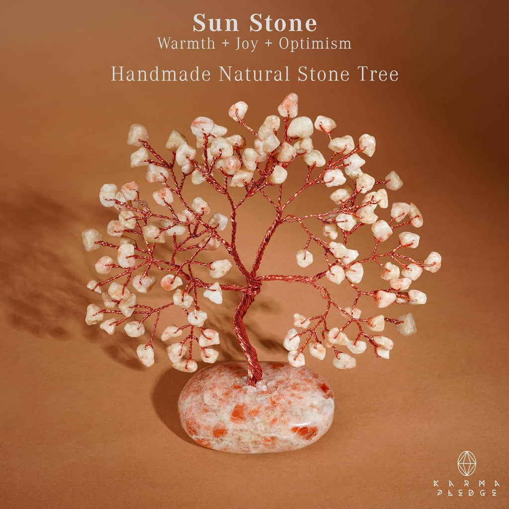 Handmade natural stone tree ornament with red branches and oval orange-pink base