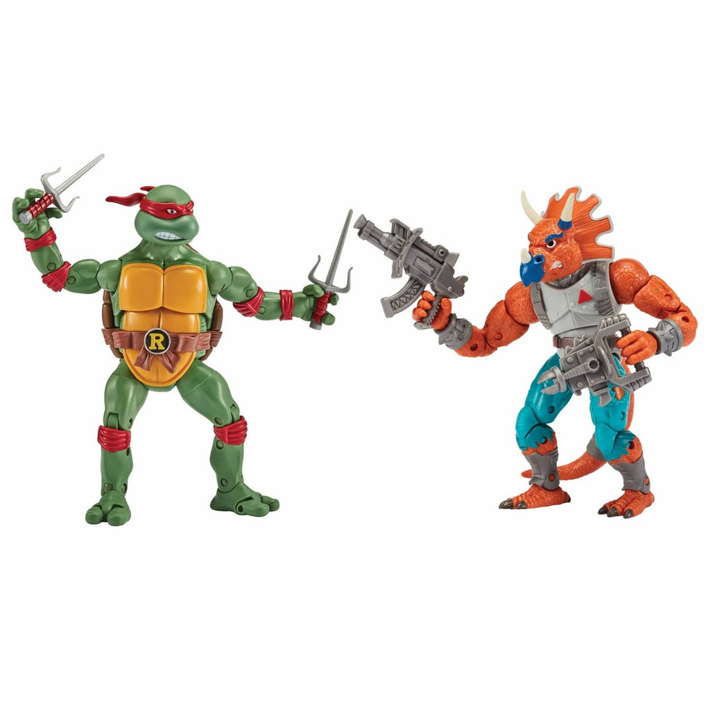 TMNT action figure 2-pack showing green turtle holding sword and orange triceraton blaster