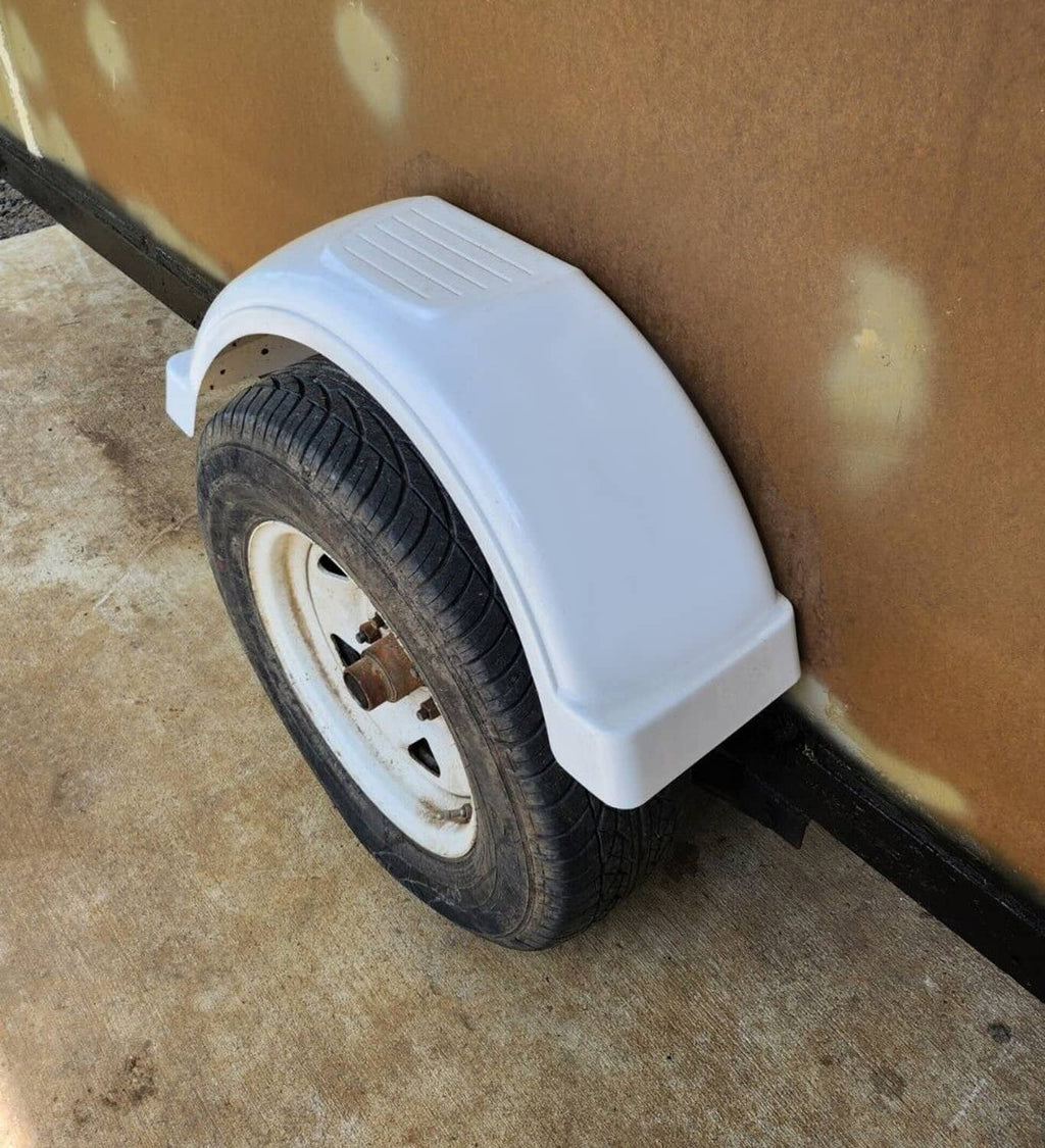 White trailer fender installed with arched shell over front wheel