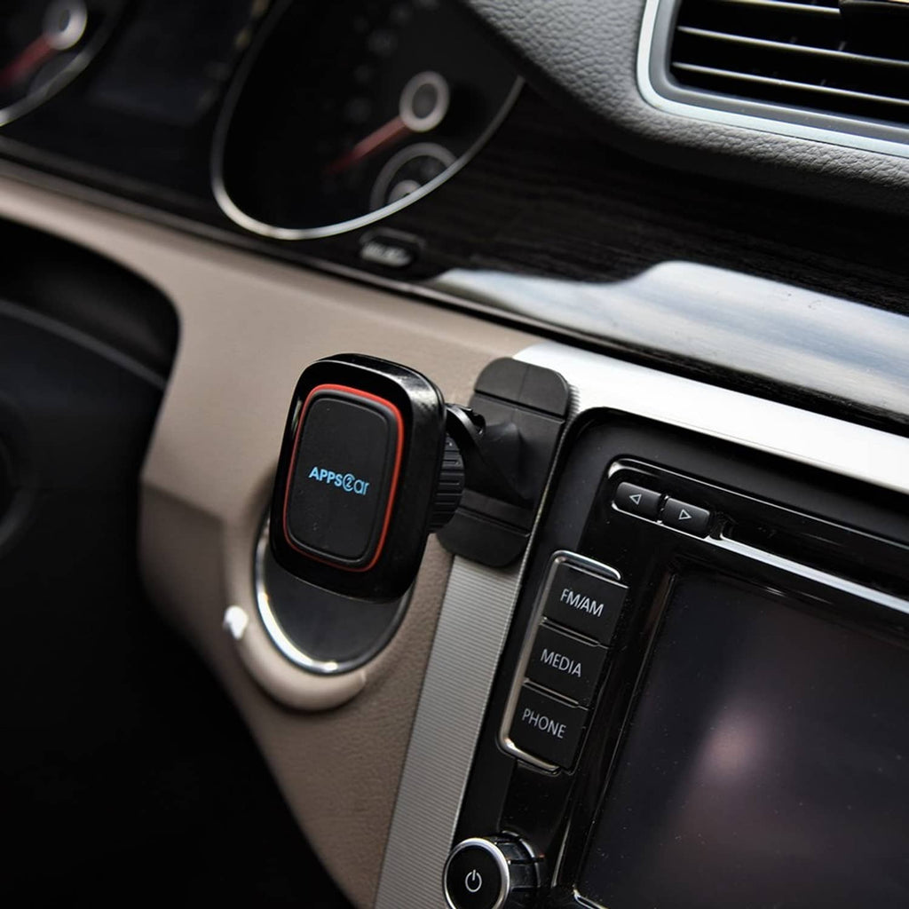 Black magnetic phone holder mounted on car interior near the dashboard vents