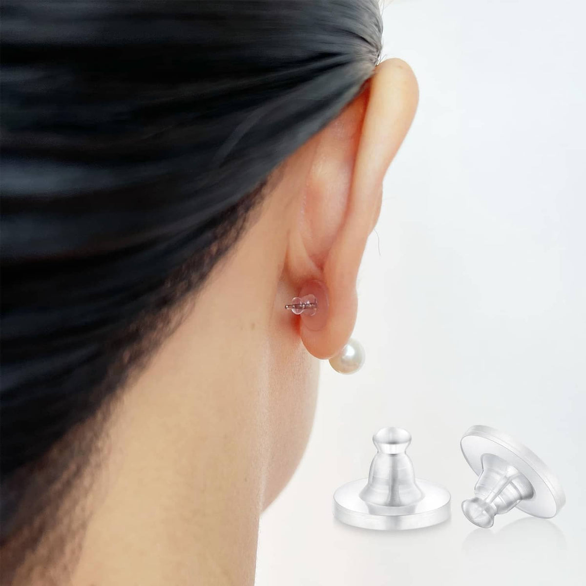 Clear silicone earring back on stud earring post, with matching spare backs