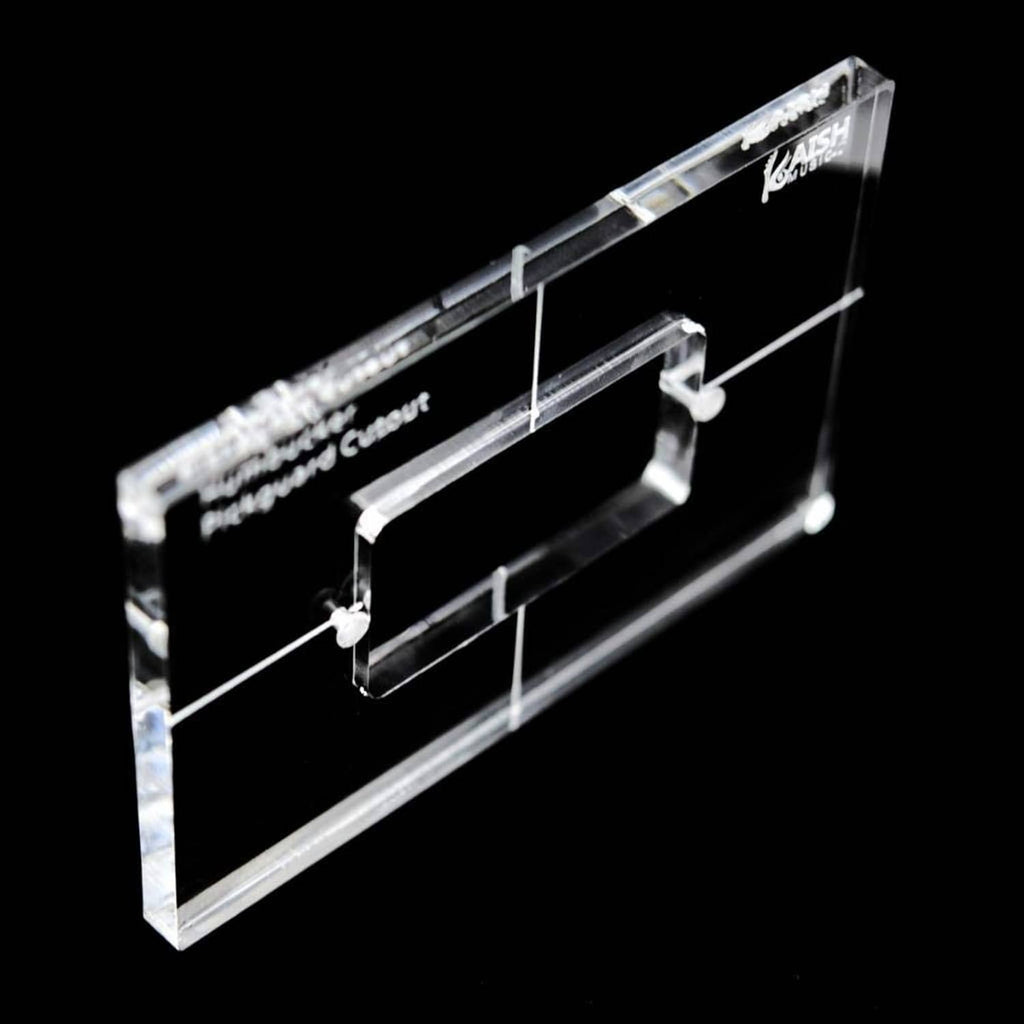 Clear acrylic humbucker routing template with bracket cutout, angled view