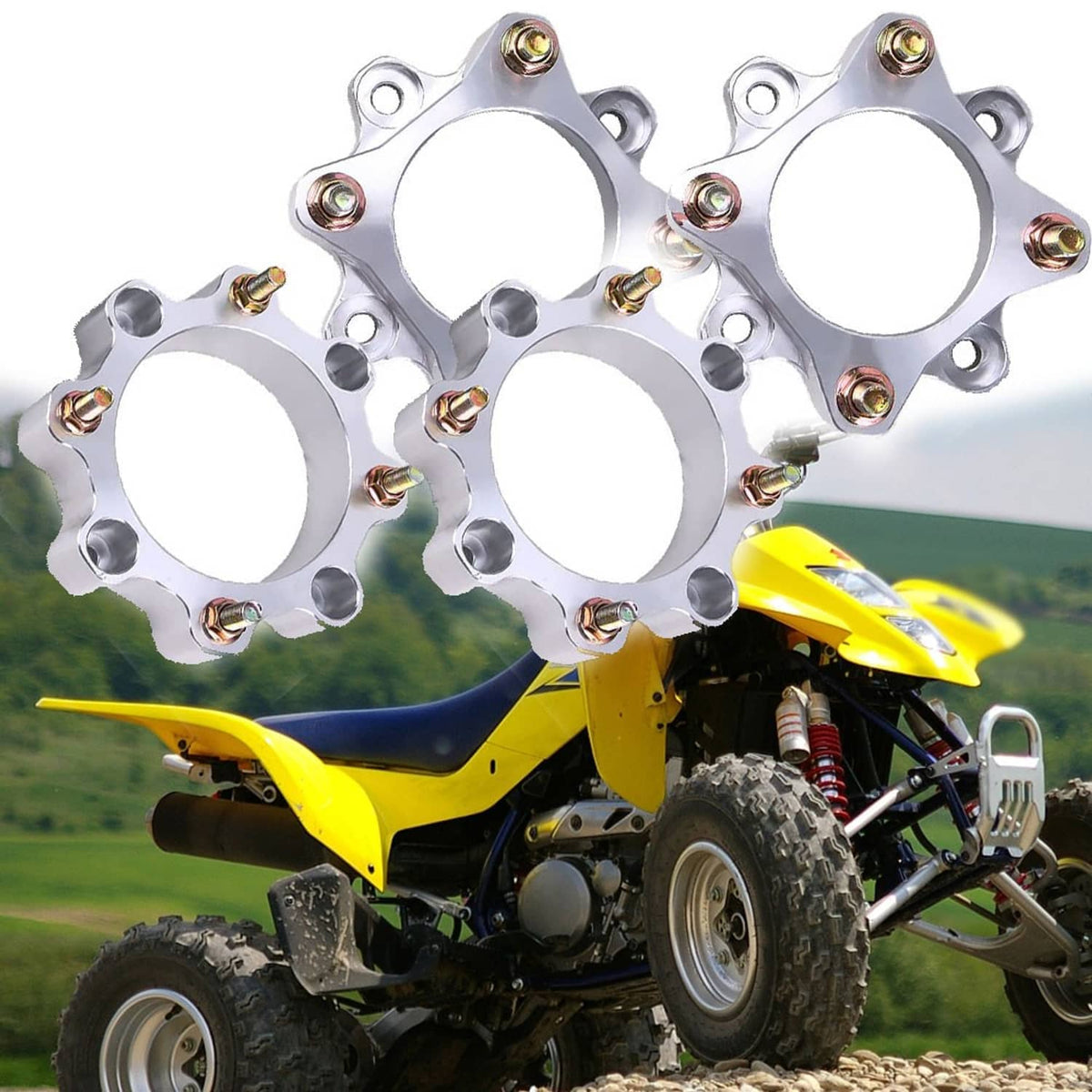 Wheel spacer set, silver circular spacers with gold bolts mounted on a quad