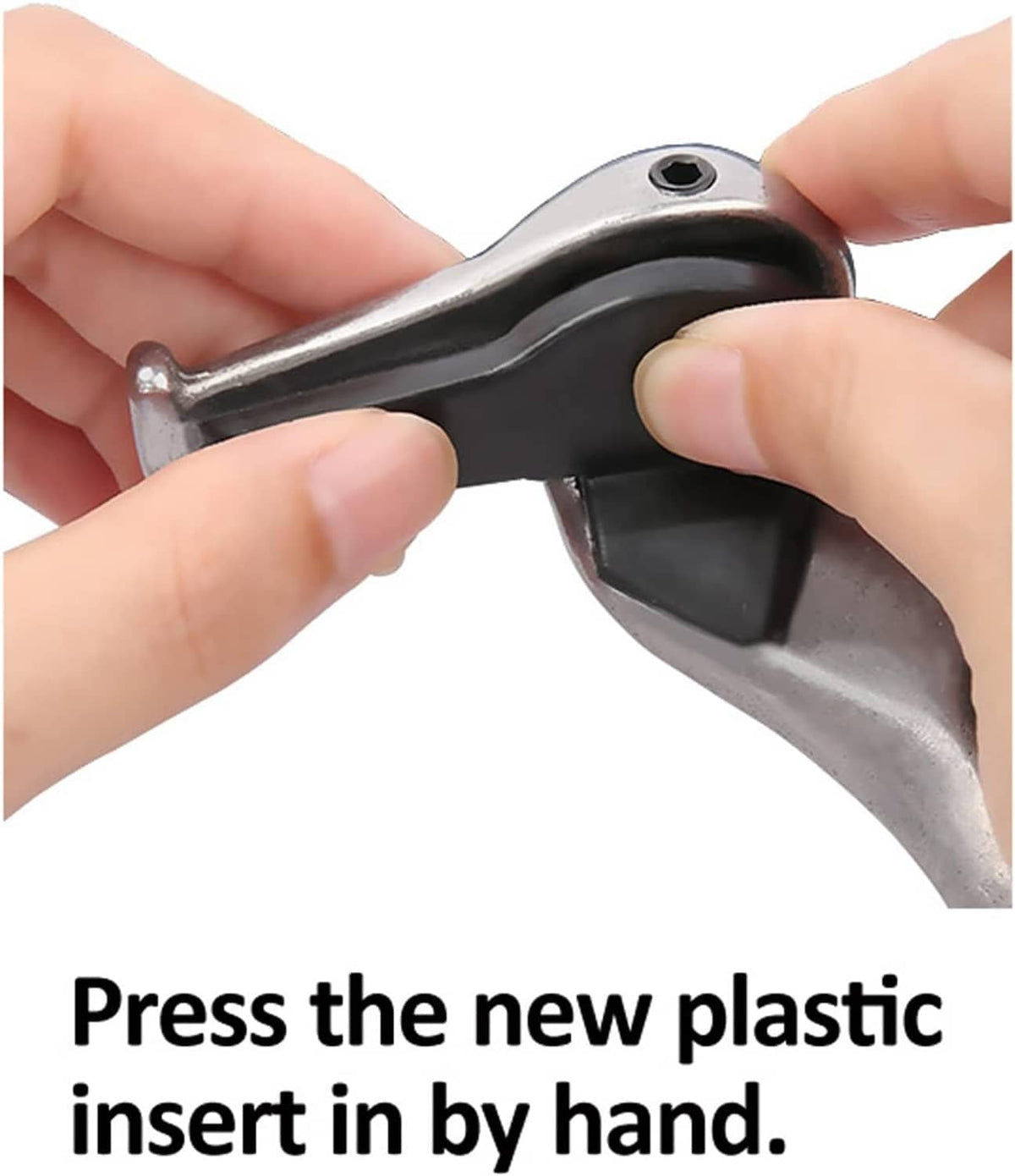 Hands pressing a black tire changer duck head insert into the tool