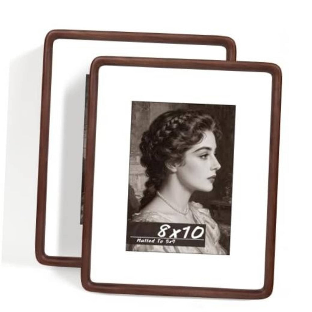 Set of 2 walnut 8x10 picture frames, angled front view with photo behind glass