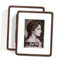 Set of 2 walnut 8x10 picture frames, angled front view with photo behind glass