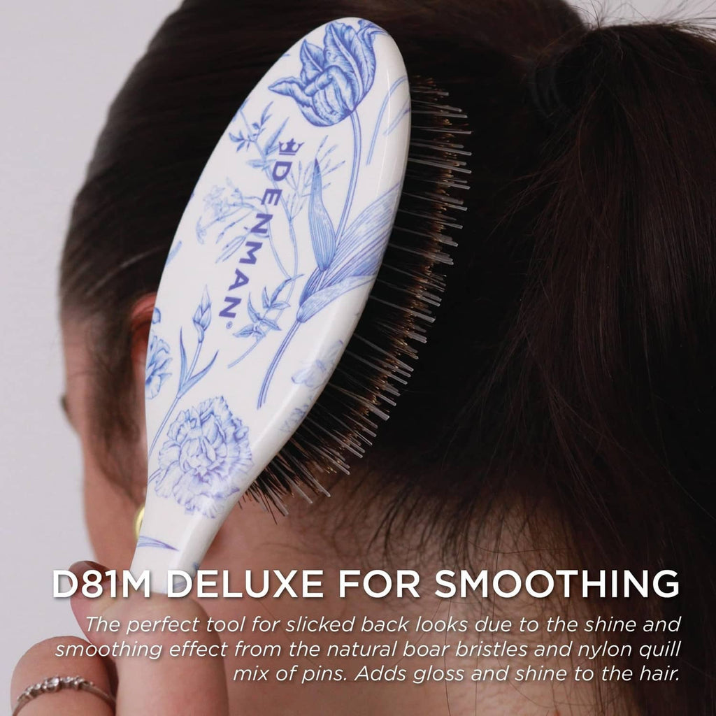 Boar bristle paddle brush with blue floral cushion and dark bristles