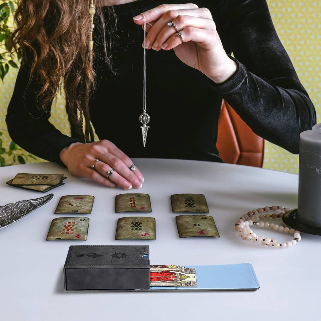 Grey tarot card case with open blue interior used to hold and organize cards