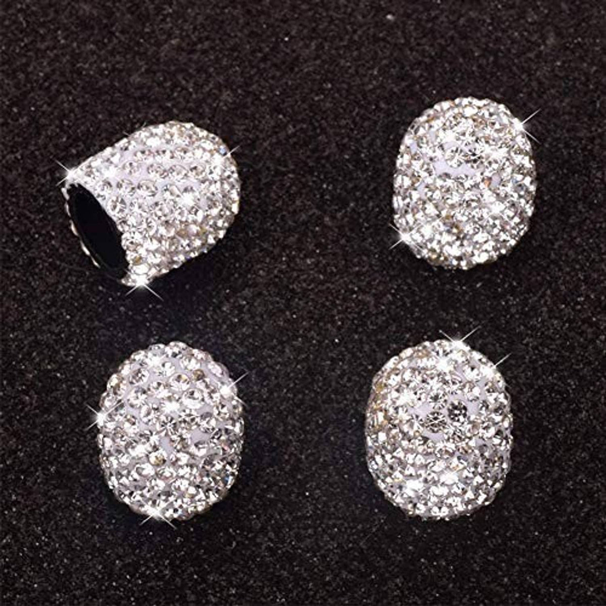 Crystal rhinestone valve stem caps, 4-pack on dark surface