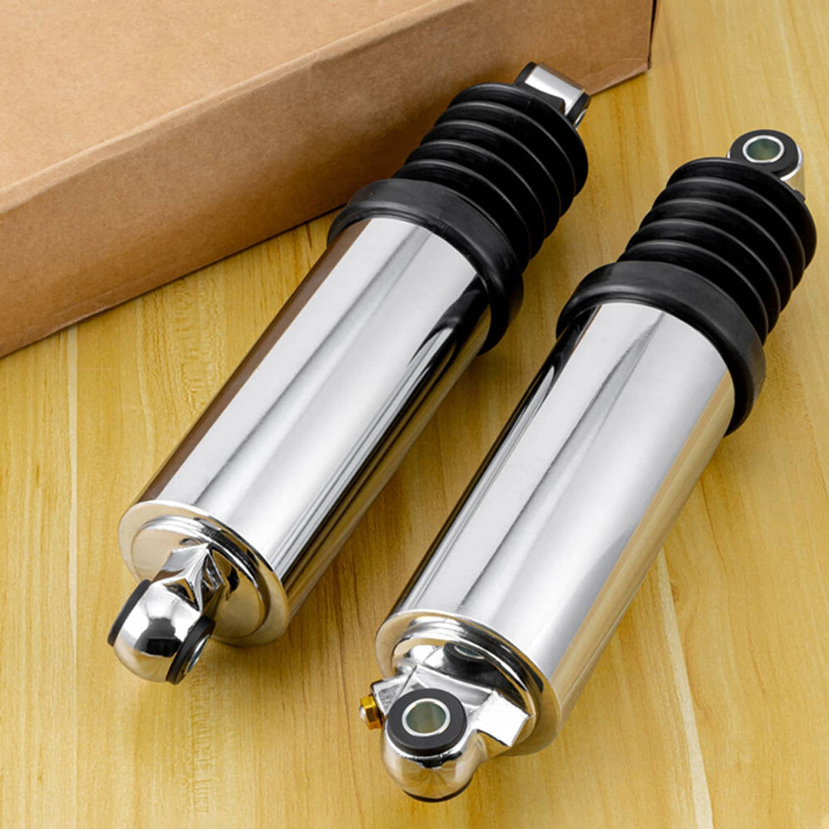 Two rear air shocks with chrome reservoirs and black bellows, chrome base eyelets