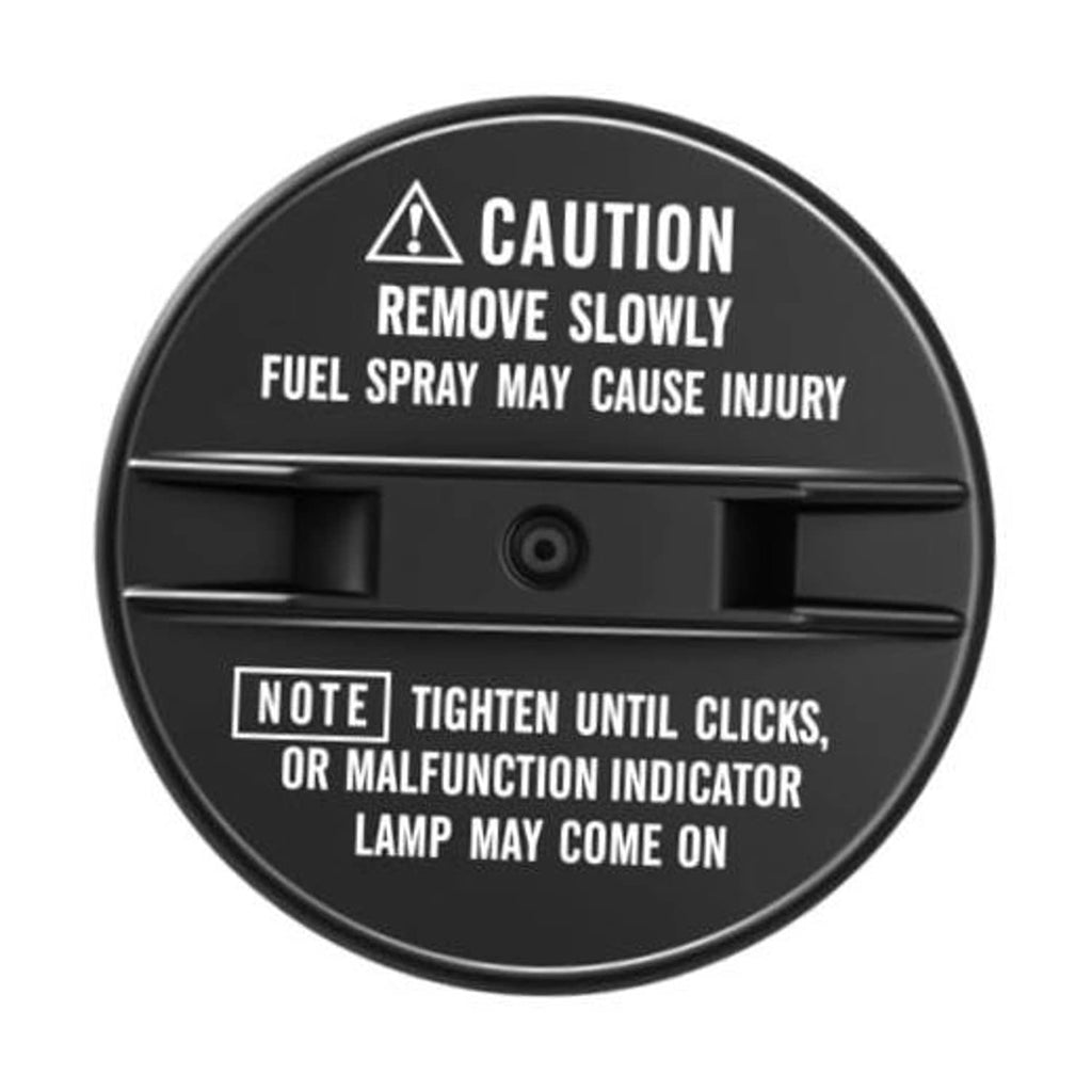 Black fuel tank cap with circular caution label and center release button