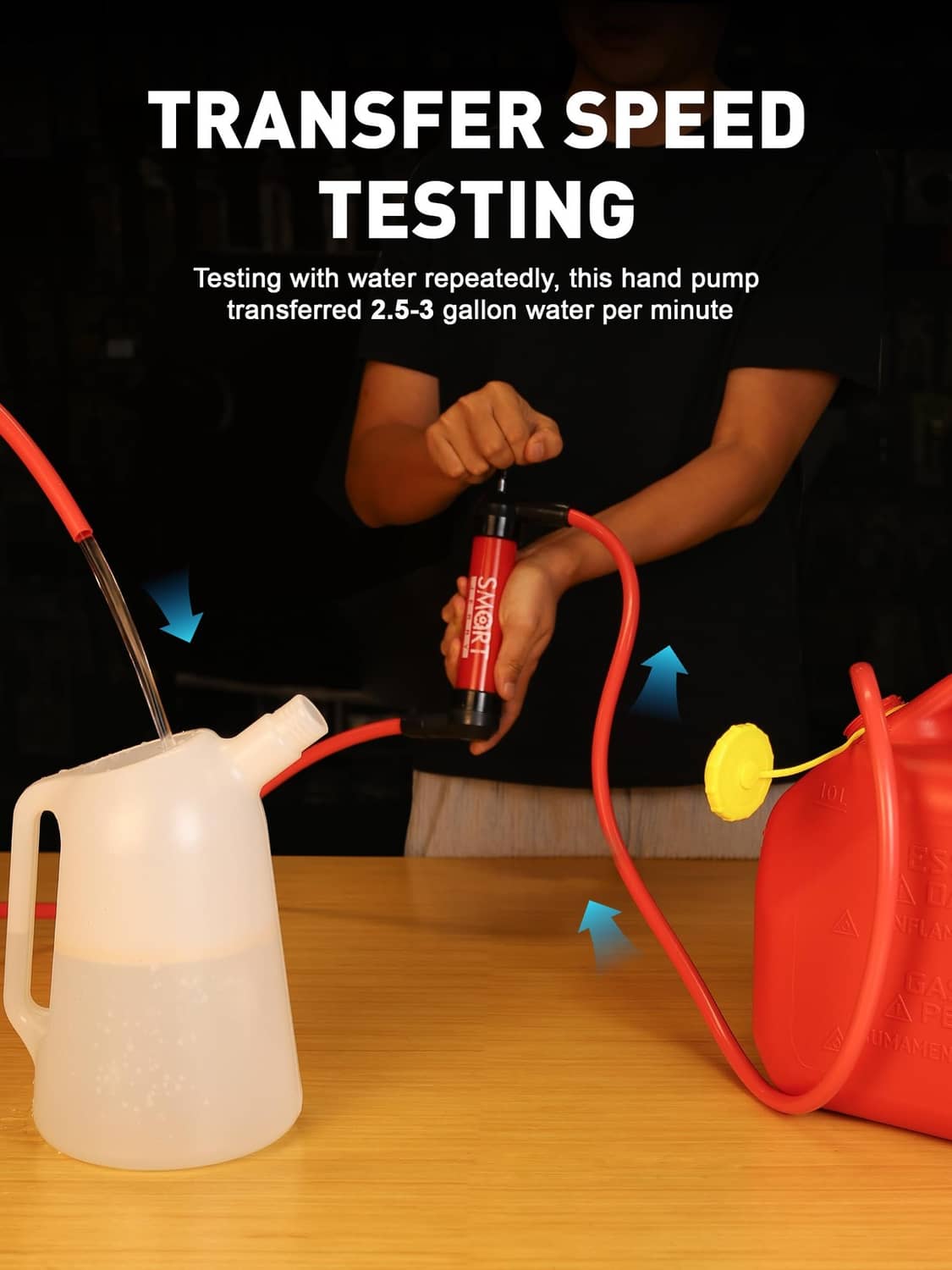 Red hand transfer pump with hose attached to a water container