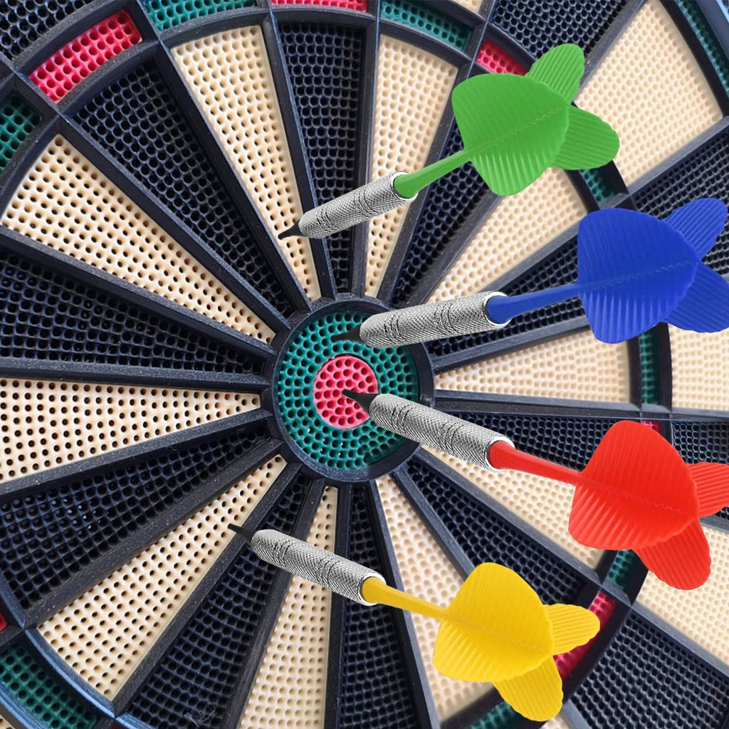Soft tip dart tips in a dartboard with green, blue, red, and yellow flights and silver shafts