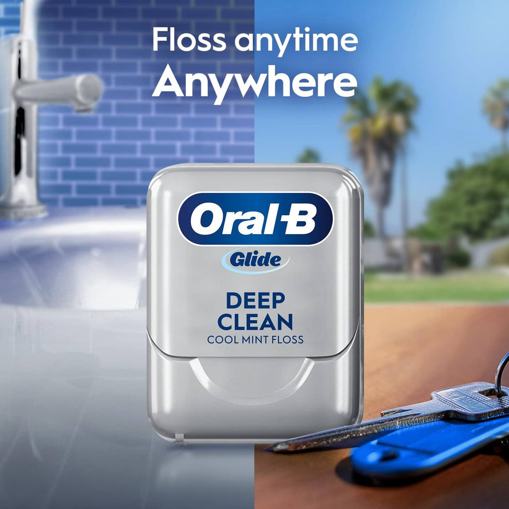 Oral-B Glide deep clean cool mint floss case on counter with floss thread