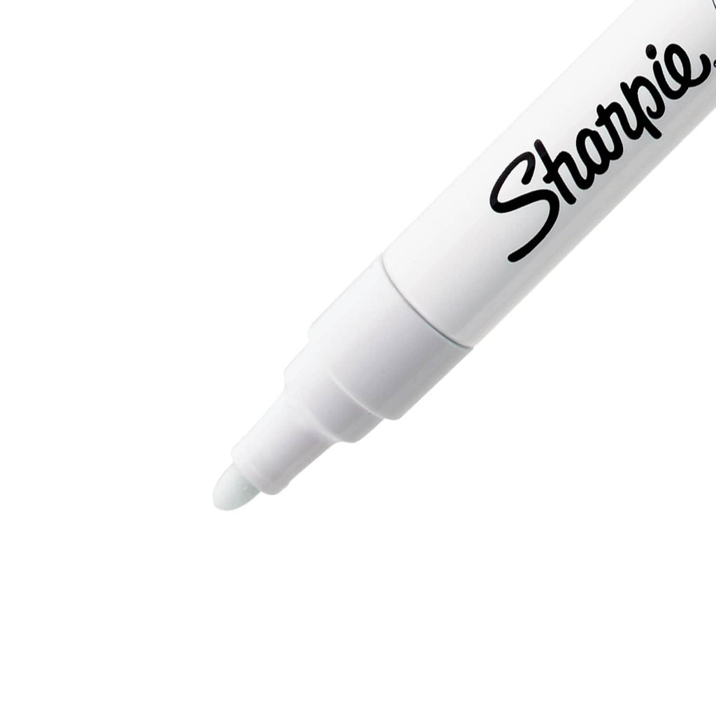 White Sharpie oil-based paint marker with medium tip, close-up