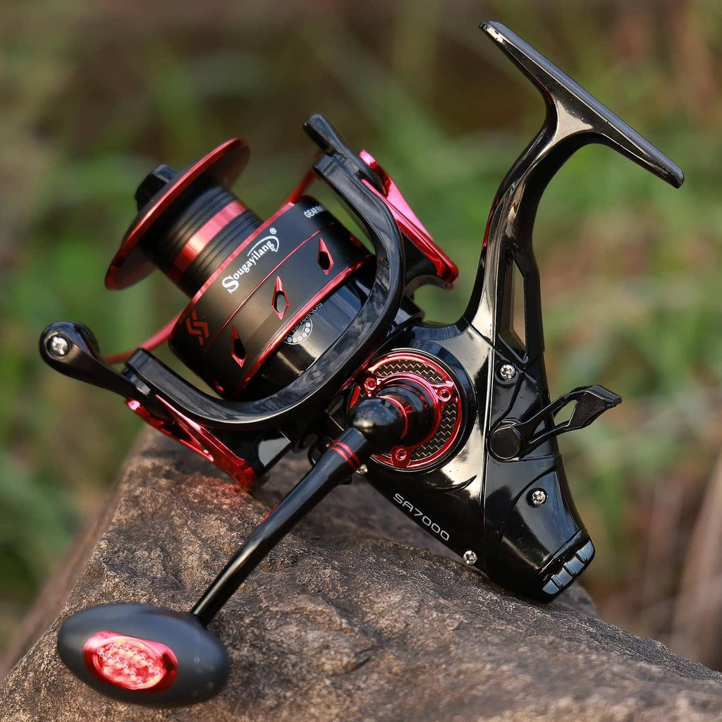 Black and red spinning fishing reel mounted on rod with red line spool