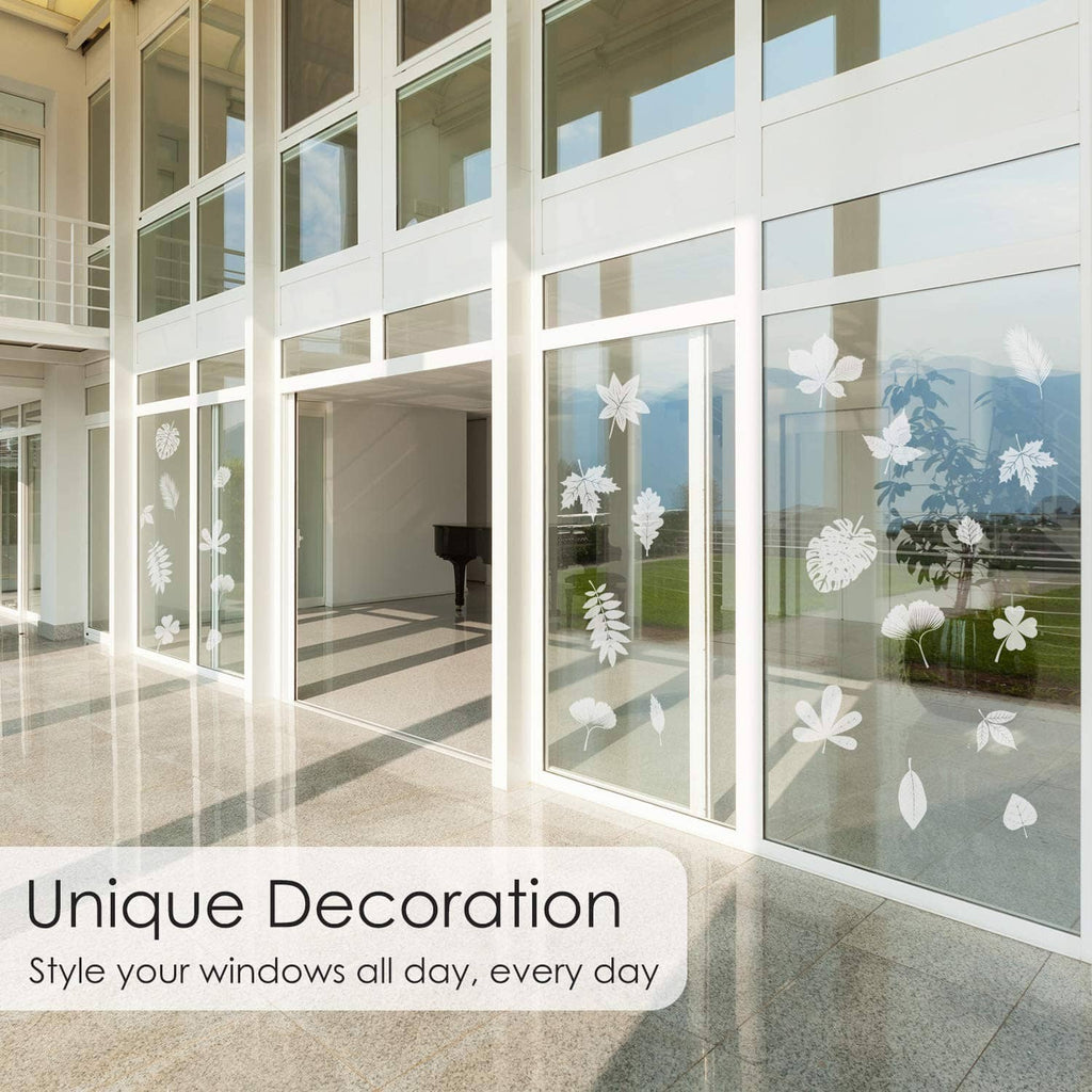 Leaf window cling decoration, white leaf and feather shapes on large window panels