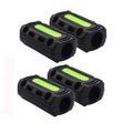 Set of black motorcycle crash bar bumper blocks with neon green reflective strips