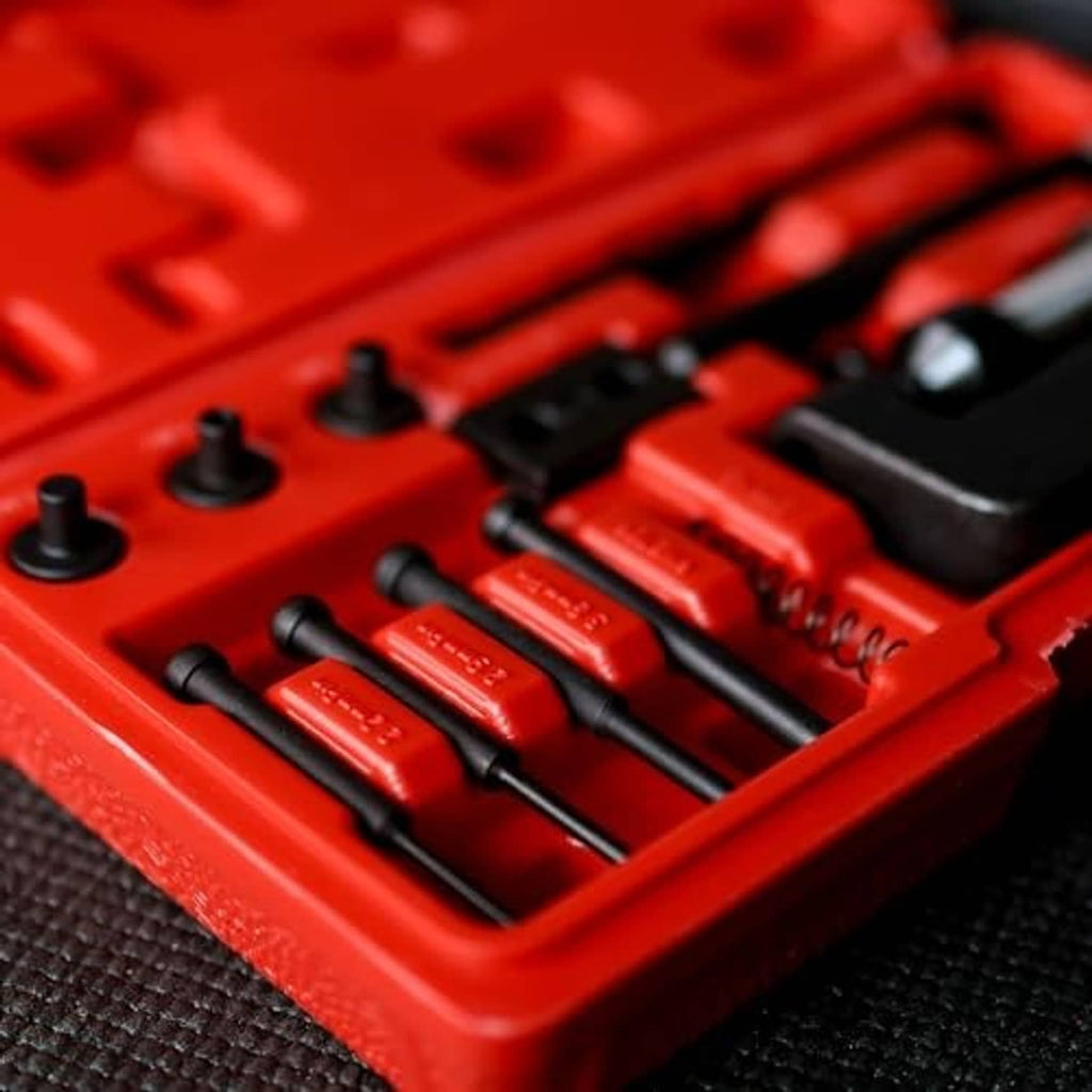 Chain breaker tool kit case insert showing riveter pins and tools in compartments